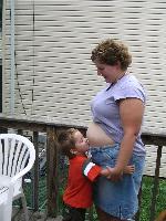 Caleb kissing baby belly